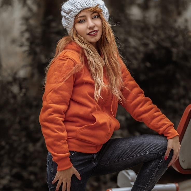 Asha Malik, Lead Design Curator at PlainHavenStudio, reviewing corporate floral arrangements